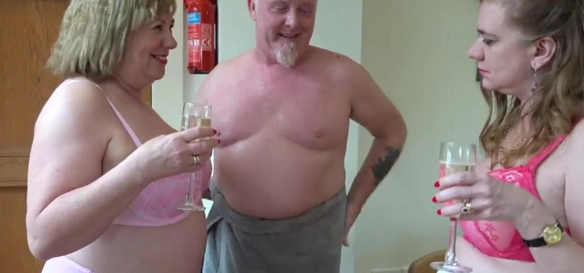 This two busty ladies whips out thehuge cock and pamper him with hands. After that